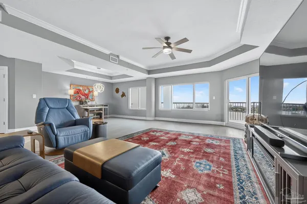 a living room with furniture and a rug