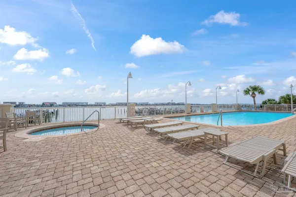 a view of a garden with lawn chairs