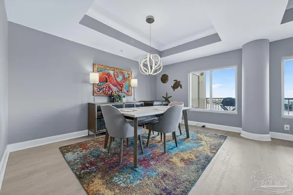 a dining room with furniture a rug and a rug