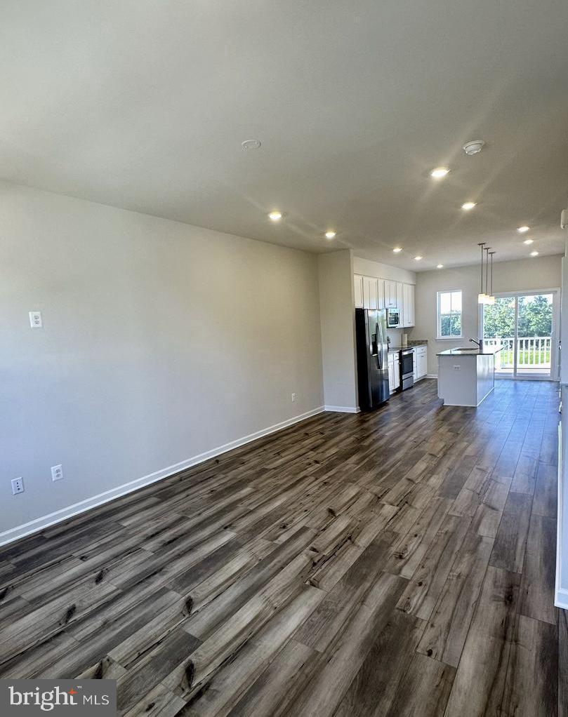 149 Swan Fld Avenue Ranson, WV 25438 - Photo 17 of 33 a view of an empty room with wooden floor
