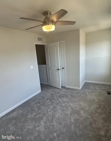 an empty room with a empty space and a window
