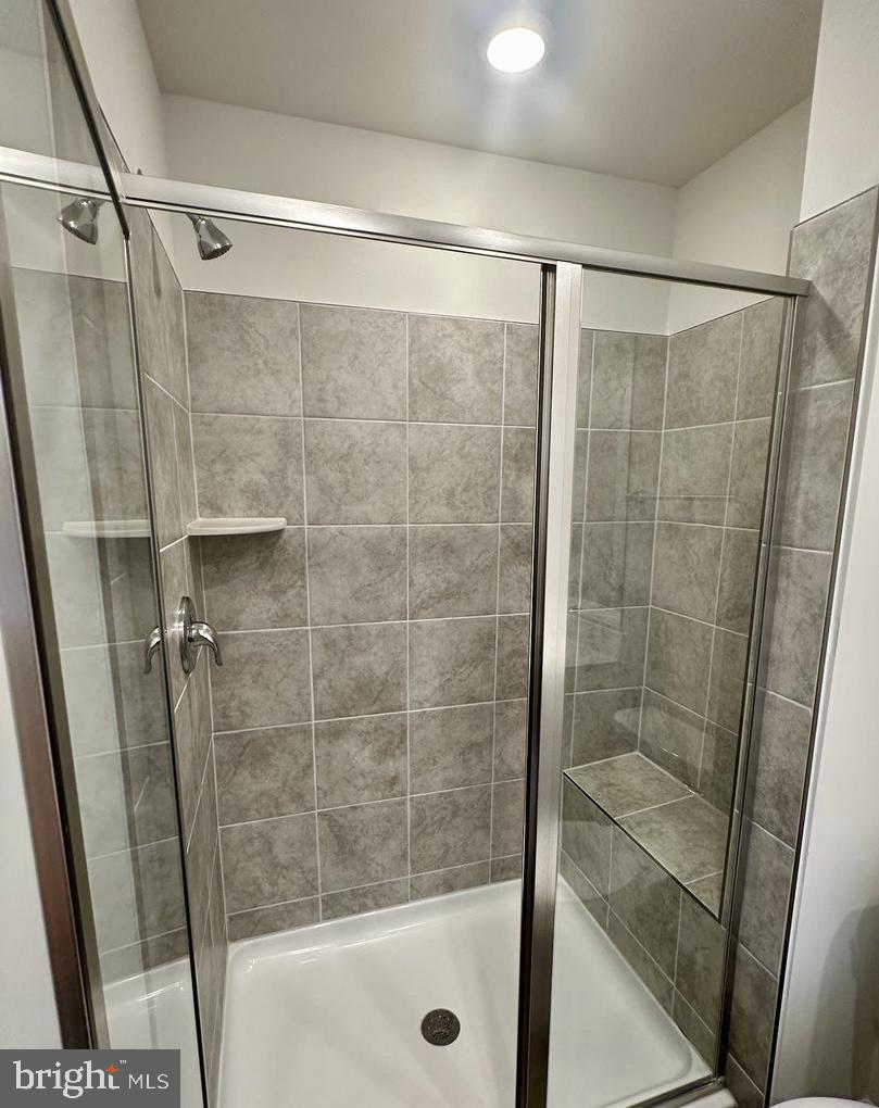 149 Swan Fld Avenue Ranson, WV 25438 - Photo 26 of 33 a bathroom with a glass door shower