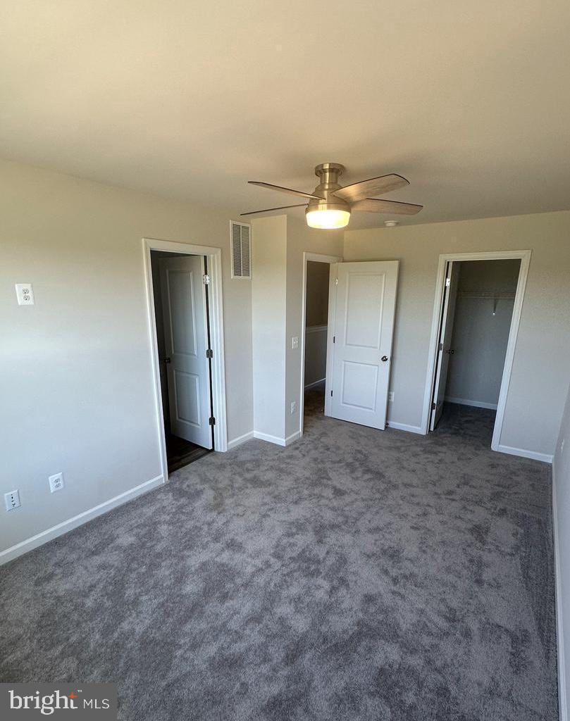 149 Swan Fld Avenue Ranson, WV 25438 - Photo 28 of 33 a view of a big room with closet and chandelier fan