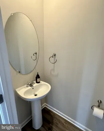 a bathroom with a sink and mirror