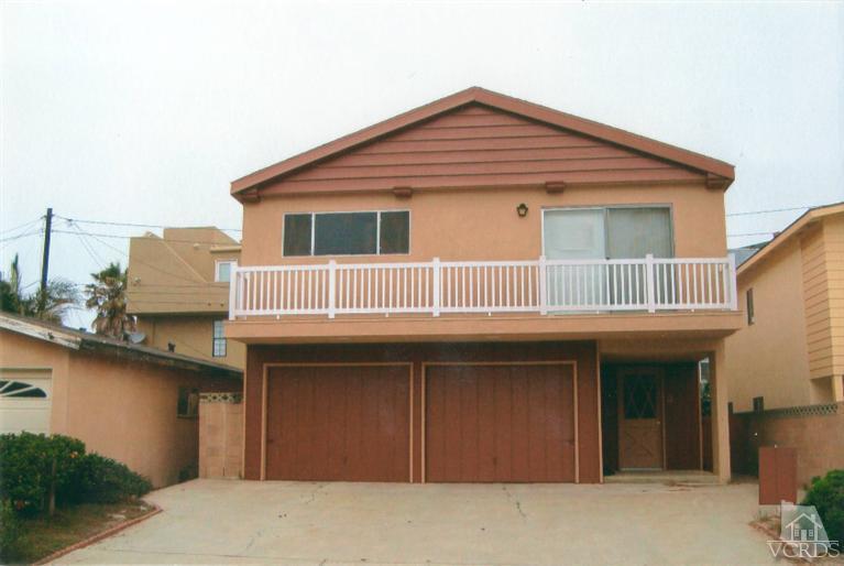 121 Santa Rosa Avenue Oxnard, CA 93035 - Photo 2 of 19 a front view of a house with yard and parking