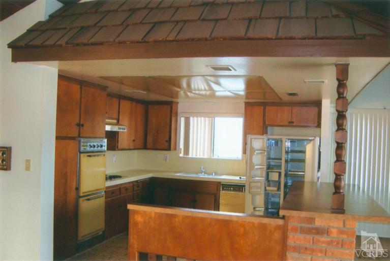 121 Santa Rosa Avenue Oxnard, CA 93035 - Photo 12 of 19 a kitchen with a refrigerator and a sink