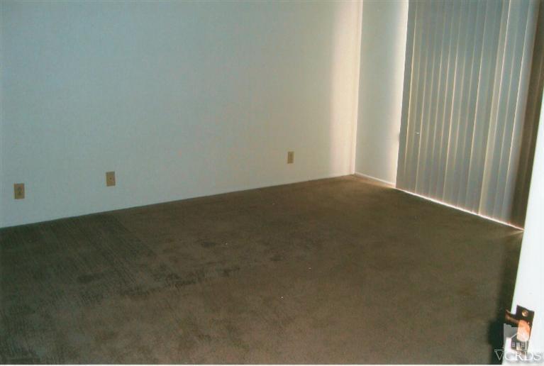 121 Santa Rosa Avenue Oxnard, CA 93035 - Photo 16 of 19 an empty room with a door