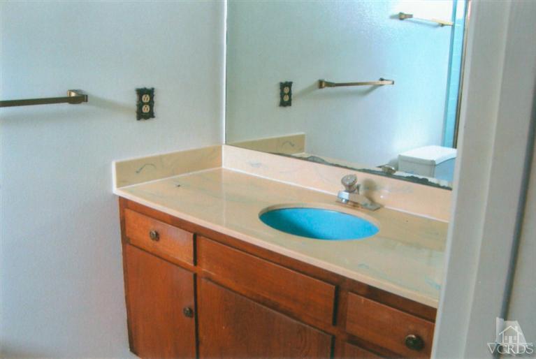 121 Santa Rosa Avenue Oxnard, CA 93035 - Photo 17 of 19 a bathroom with a sink and a mirror