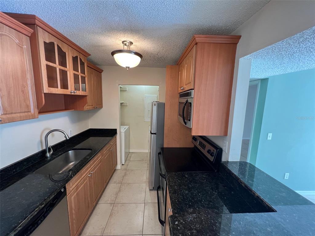 455 Alt 19, Unit 159 Palm Harbor, FL 34683 - Photo 7 of 26 a bathroom with a sink and a large mirror