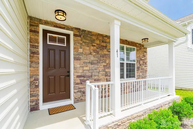 a front view of a house with a porch