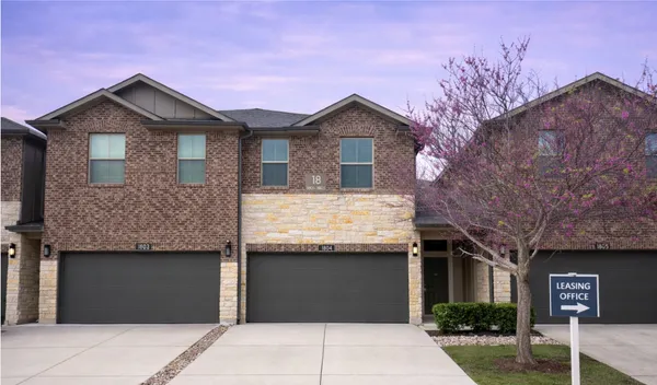 a front view of a house with garage