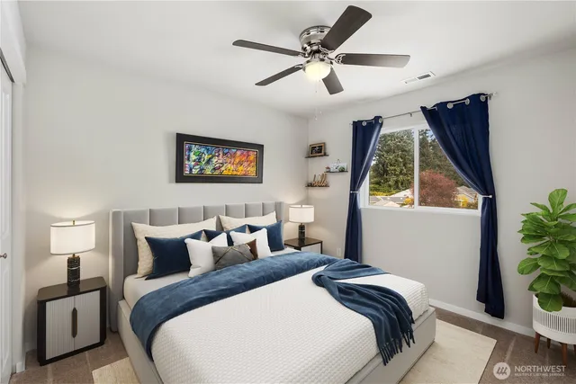 a bedroom with bed and a window