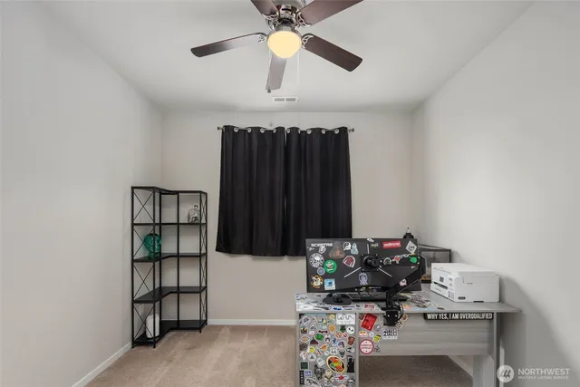 a view of a workspace with furniture