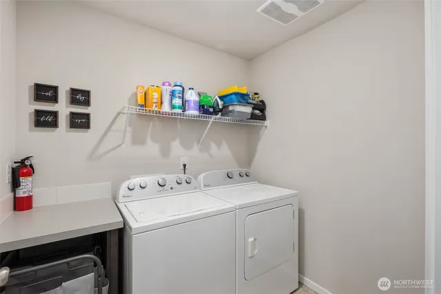 a utility room with dryer and washer