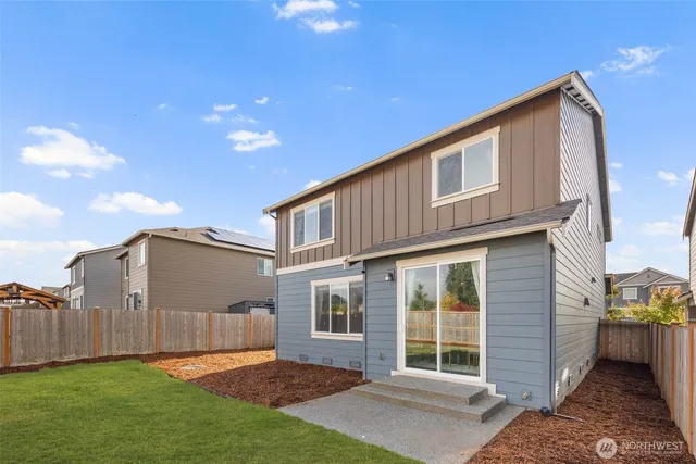 a view of a house with backyard and porch