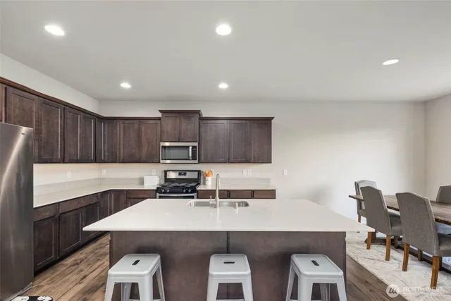 a kitchen with a sink cabinets and window