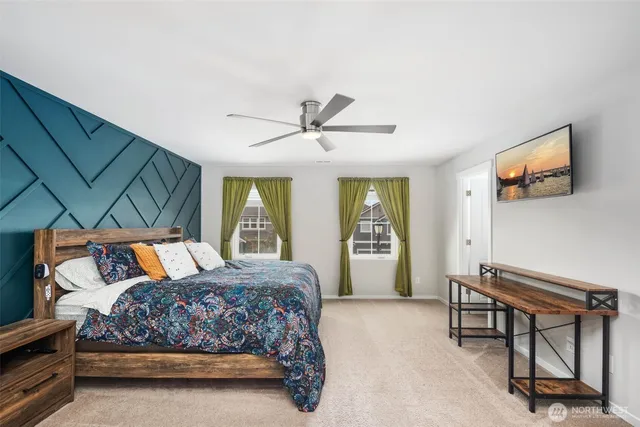 a bedroom with a bed and a table in it