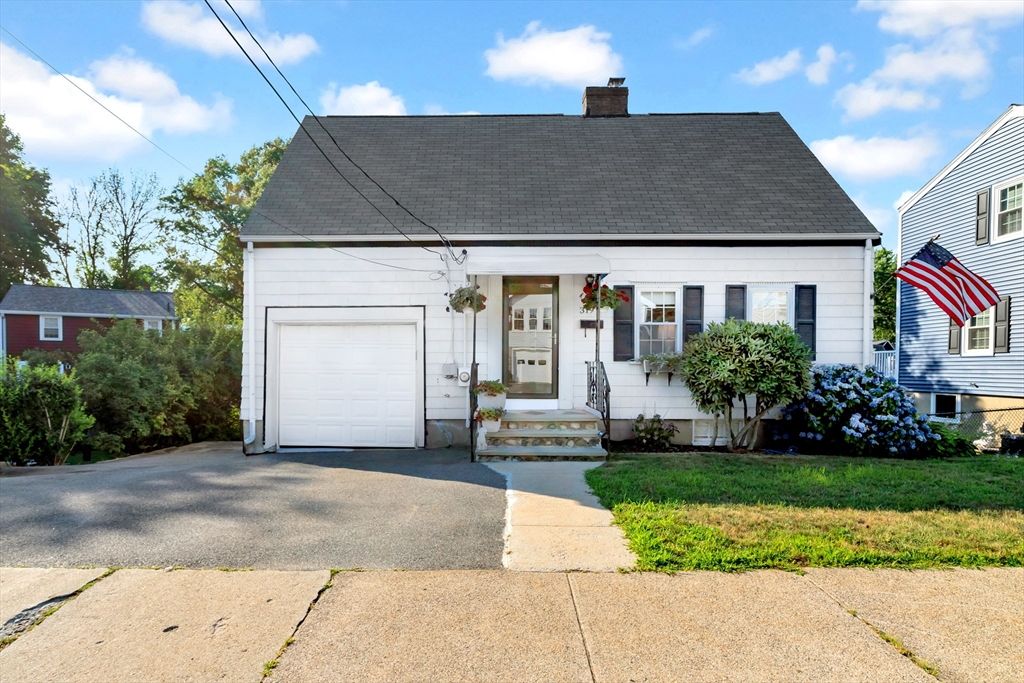 319 Appleton Street Arlington, MA 02476 - Photo 1 of 39 a front view of a house with a garden