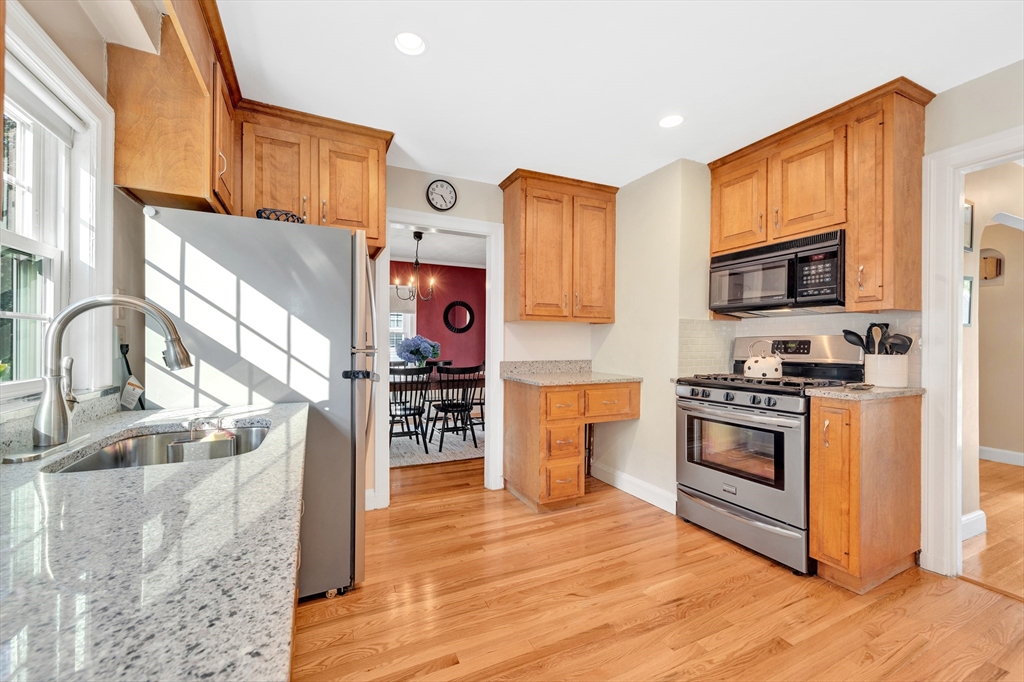 319 Appleton Street Arlington, MA 02476 - Photo 15 of 39 a kitchen with stainless steel appliances granite countertop a stove a sink and a microwave