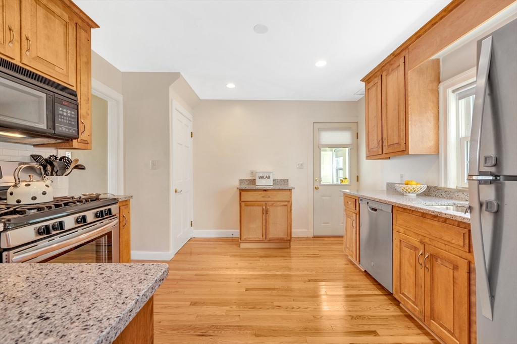 319 Appleton Street Arlington, MA 02476 - Photo 16 of 39 a kitchen with stainless steel appliances granite countertop a stove and a sink