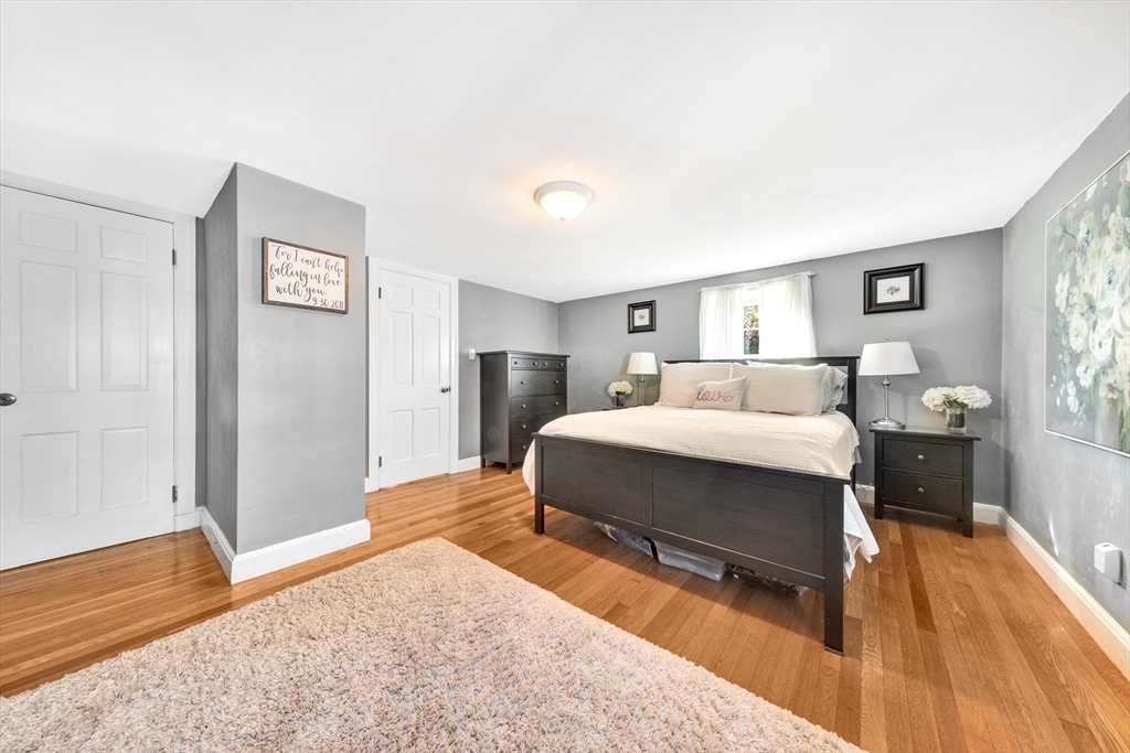 319 Appleton Street Arlington, MA 02476 - Photo 19 of 39 a bedroom with a bed and a table