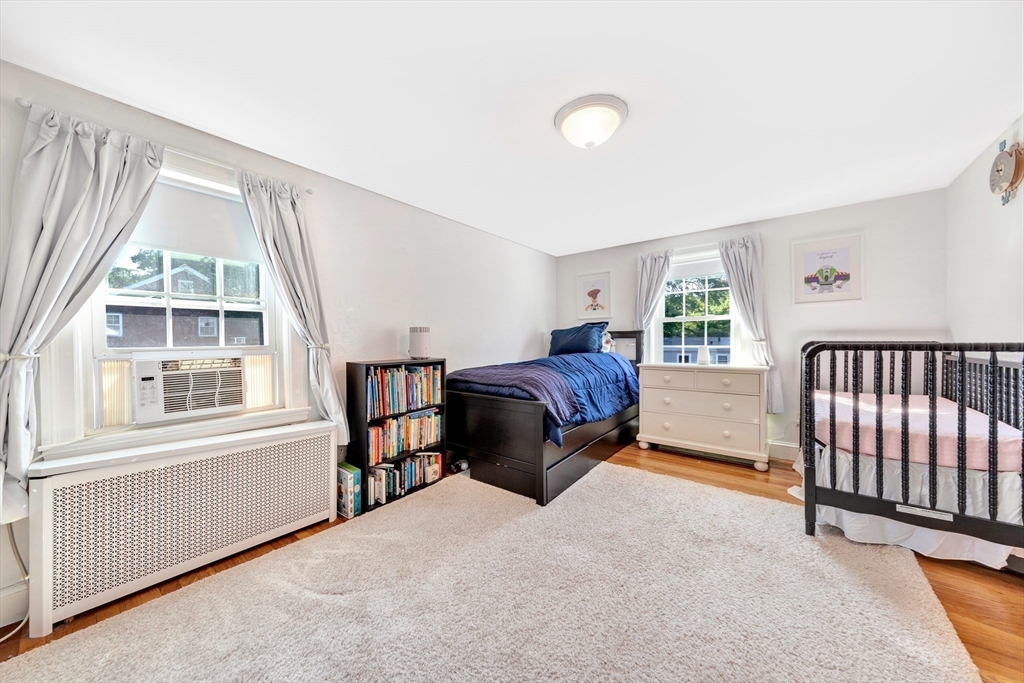 319 Appleton Street Arlington, MA 02476 - Photo 23 of 39 a spacious bedroom with a bed and a window