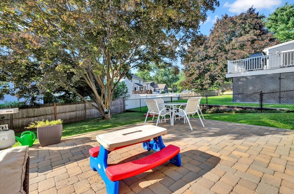 319 Appleton Street Arlington, MA 02476 - Photo 29 of 39 a view of backyard with outdoor seating ad green space