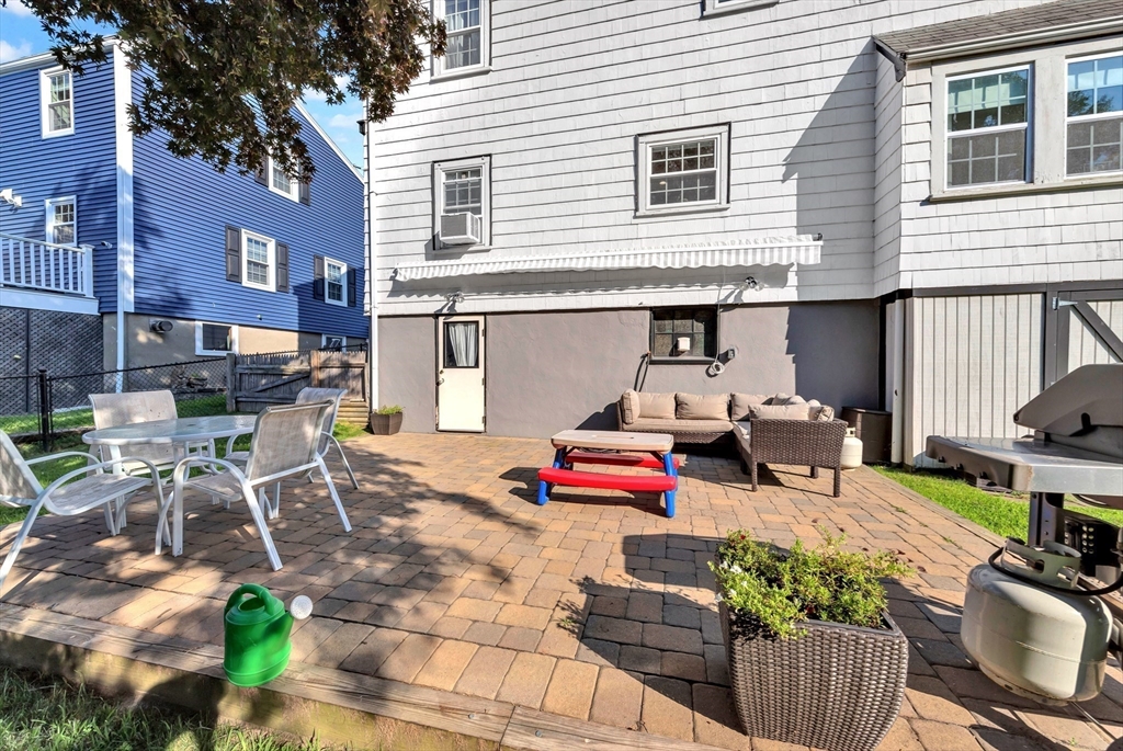 319 Appleton Street Arlington, MA 02476 - Photo 30 of 39 a backyard of a house with outdoor seating