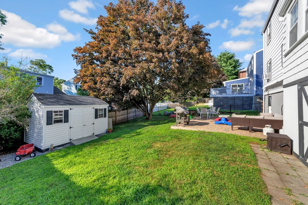 319 Appleton Street Arlington, MA 02476 - Photo 33 of 39 a view of a house with backyard sitting area and garden