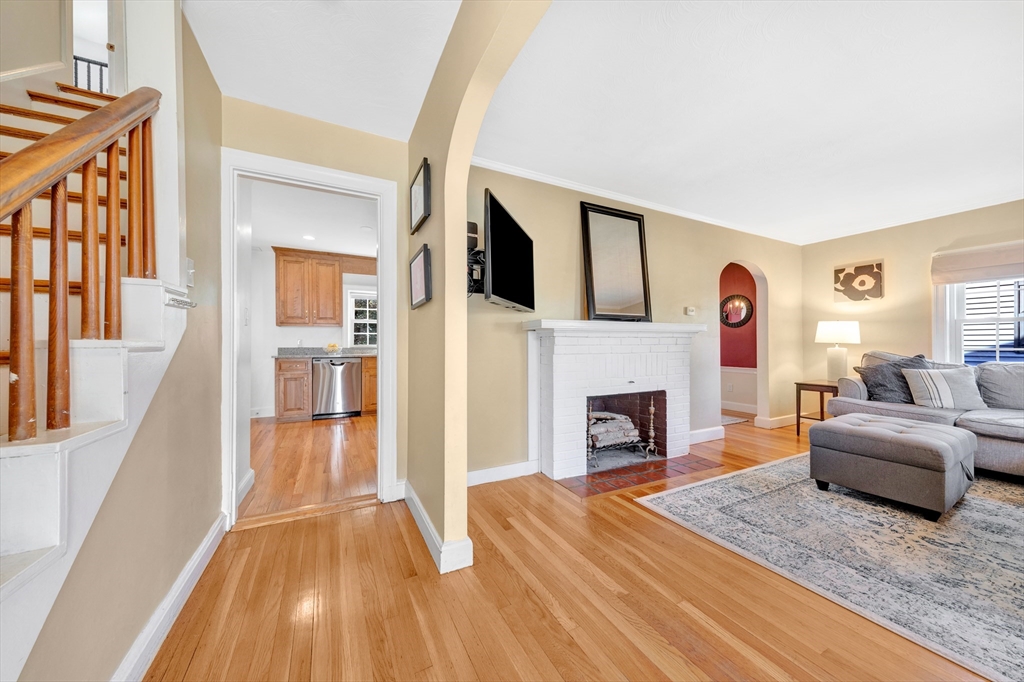 319 Appleton Street Arlington, MA 02476 - Photo 4 of 39 a living room with furniture and a fireplace