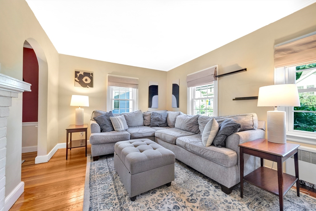319 Appleton Street Arlington, MA 02476 - Photo 6 of 39 a living room with furniture and a wooden floor