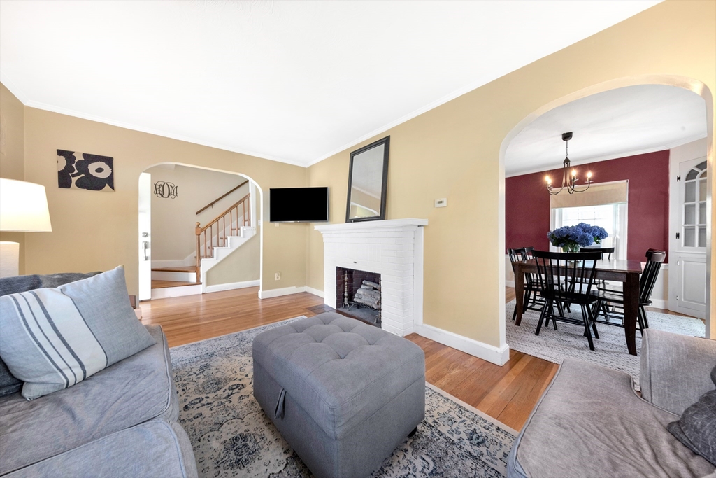 319 Appleton Street Arlington, MA 02476 - Photo 8 of 39 a living room with furniture and a fireplace