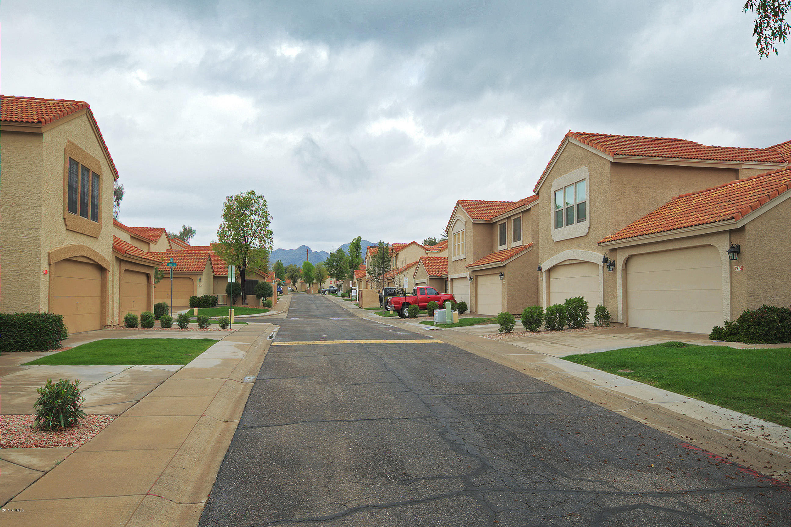 4217 East Agave Road Phoenix, AZ 85044 - Photo 2 of 20 a view of a street with a building in the background