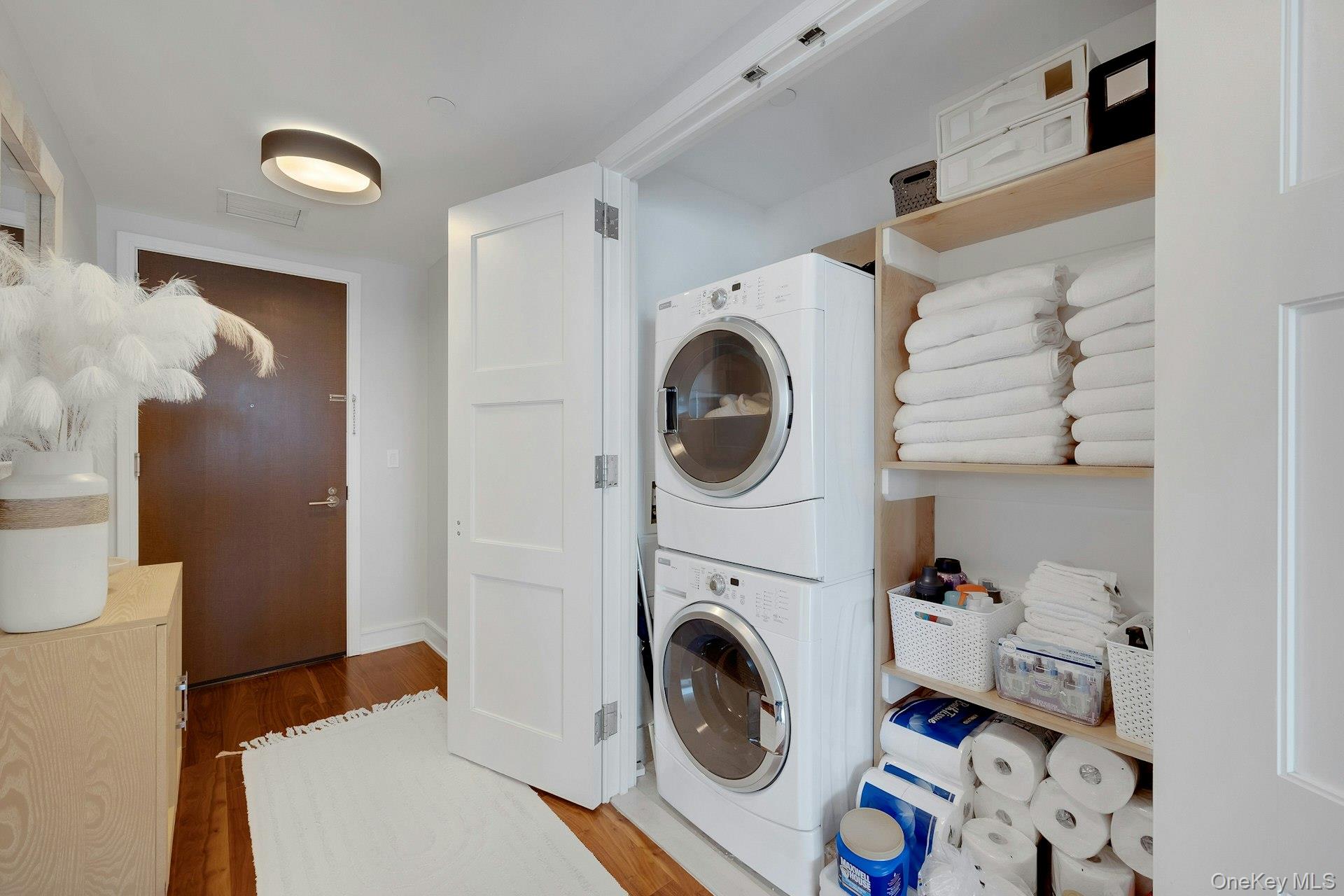5 Renaissance Square, Unit 12A White Plains, NY 10601 - Photo 15 of 36 a utility room with dryer and washer