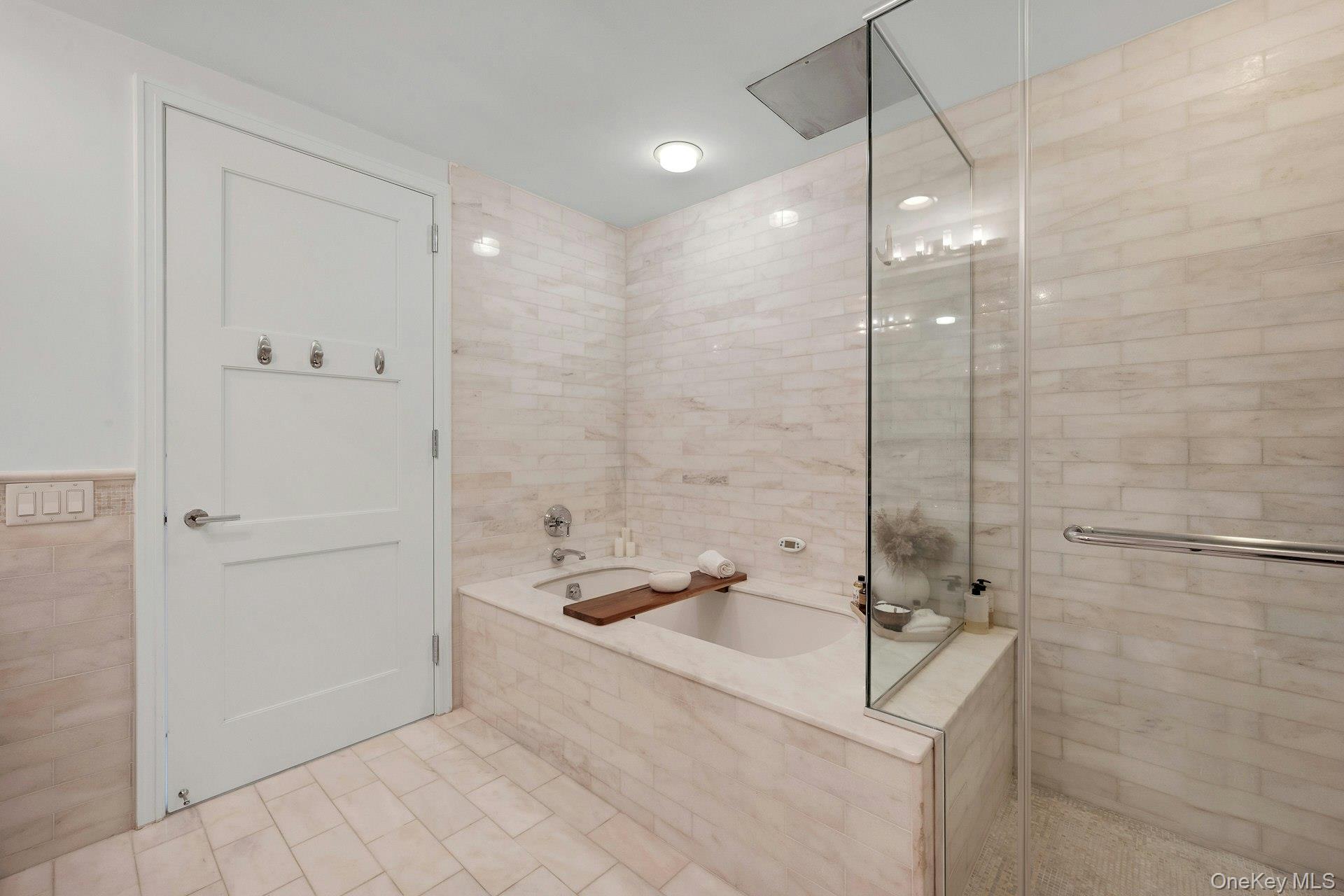 5 Renaissance Square, Unit 12A White Plains, NY 10601 - Photo 21 of 36 a bathroom with a granite countertop sink a toilet and shower