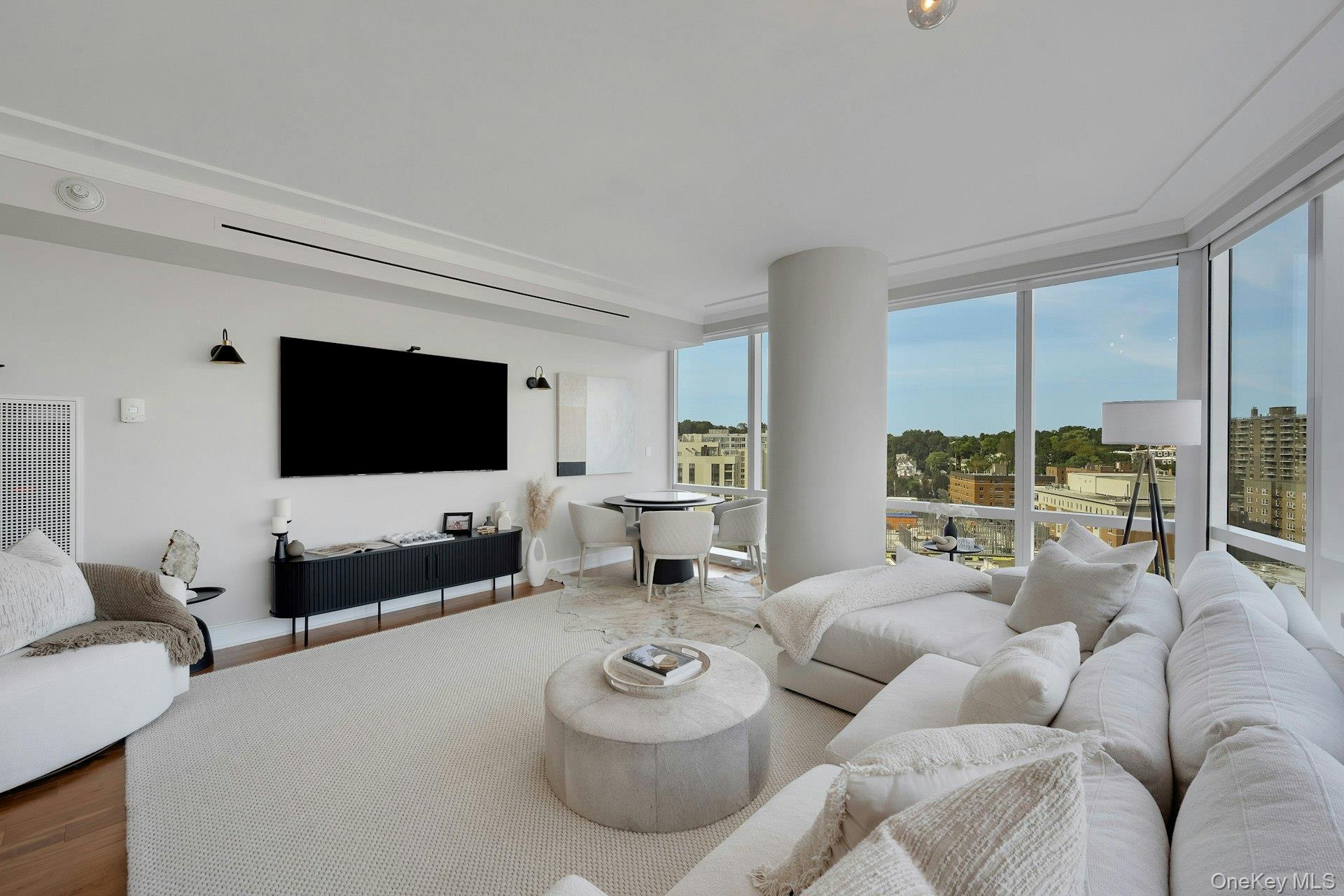 5 Renaissance Square, Unit 12A White Plains, NY 10601 - Photo 4 of 36 a living room with furniture and a flat screen tv