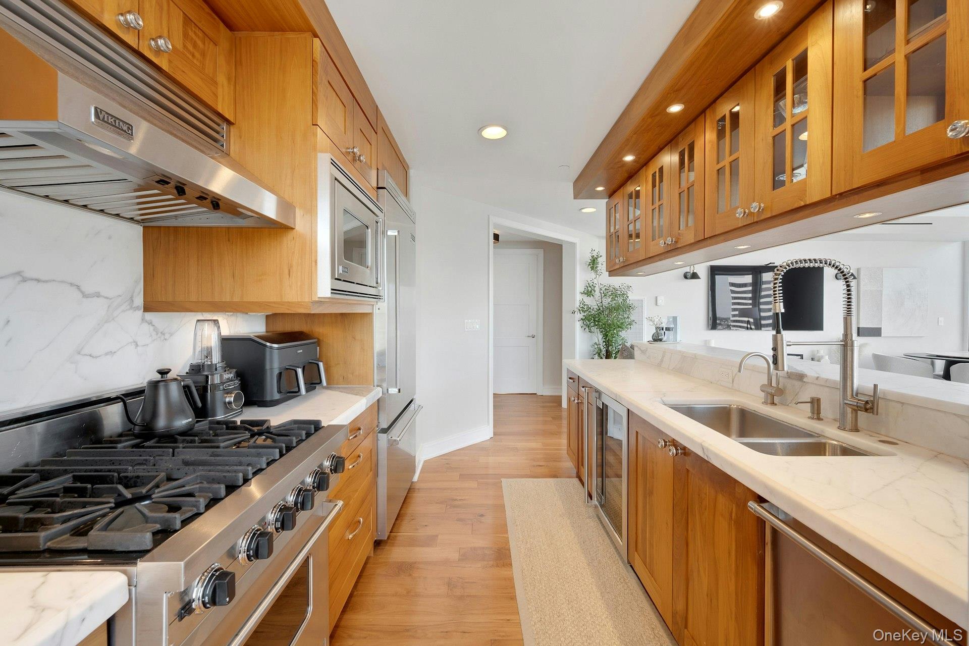 5 Renaissance Square, Unit 12A White Plains, NY 10601 - Photo 8 of 36 a kitchen with stainless steel appliances granite countertop a sink and a stove