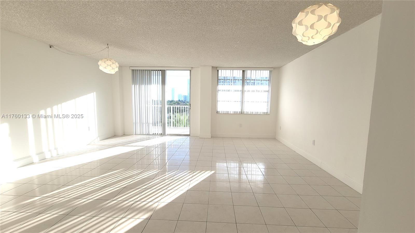 2801 Northeast 183rd Street, Unit 504W Aventura, FL 33160 - Photo 1 of 36 a view of an empty room with a window