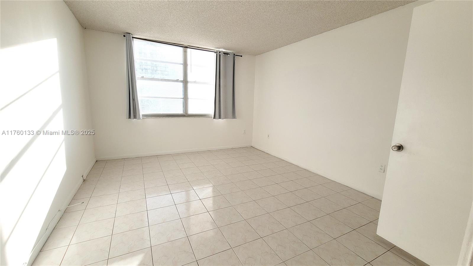 2801 Northeast 183rd Street, Unit 504W Aventura, FL 33160 - Photo 13 of 36 an empty room with windows