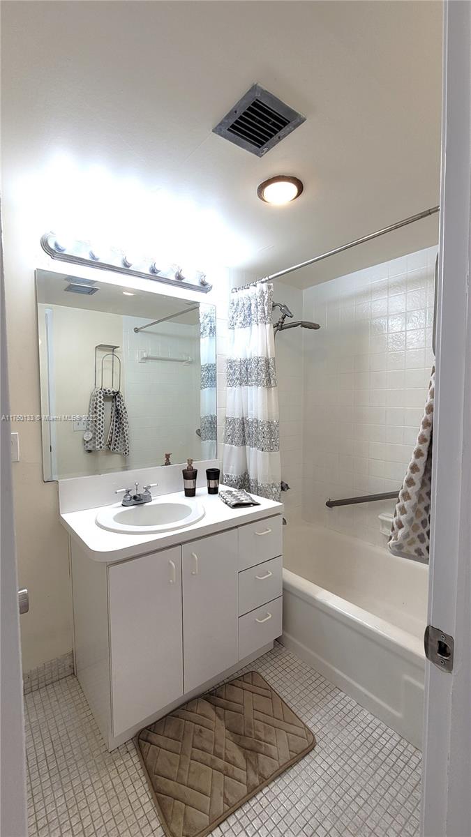 2801 Northeast 183rd Street, Unit 504W Aventura, FL 33160 - Photo 17 of 36 a bathroom with a sink a toilet and shower