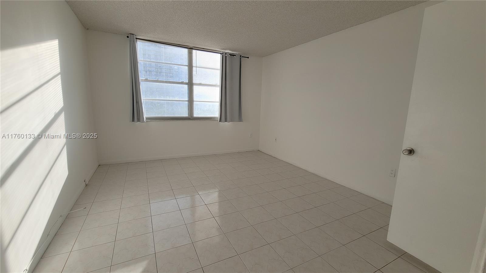 2801 Northeast 183rd Street, Unit 504W Aventura, FL 33160 - Photo 25 of 36 an empty room with windows