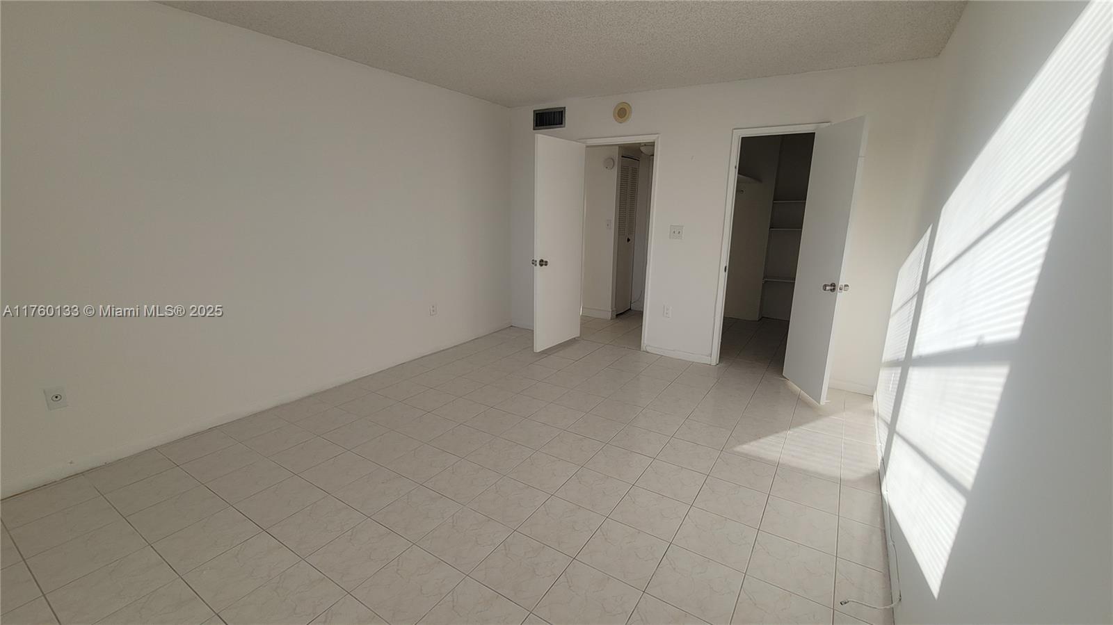 2801 Northeast 183rd Street, Unit 504W Aventura, FL 33160 - Photo 26 of 36 an empty room with windows