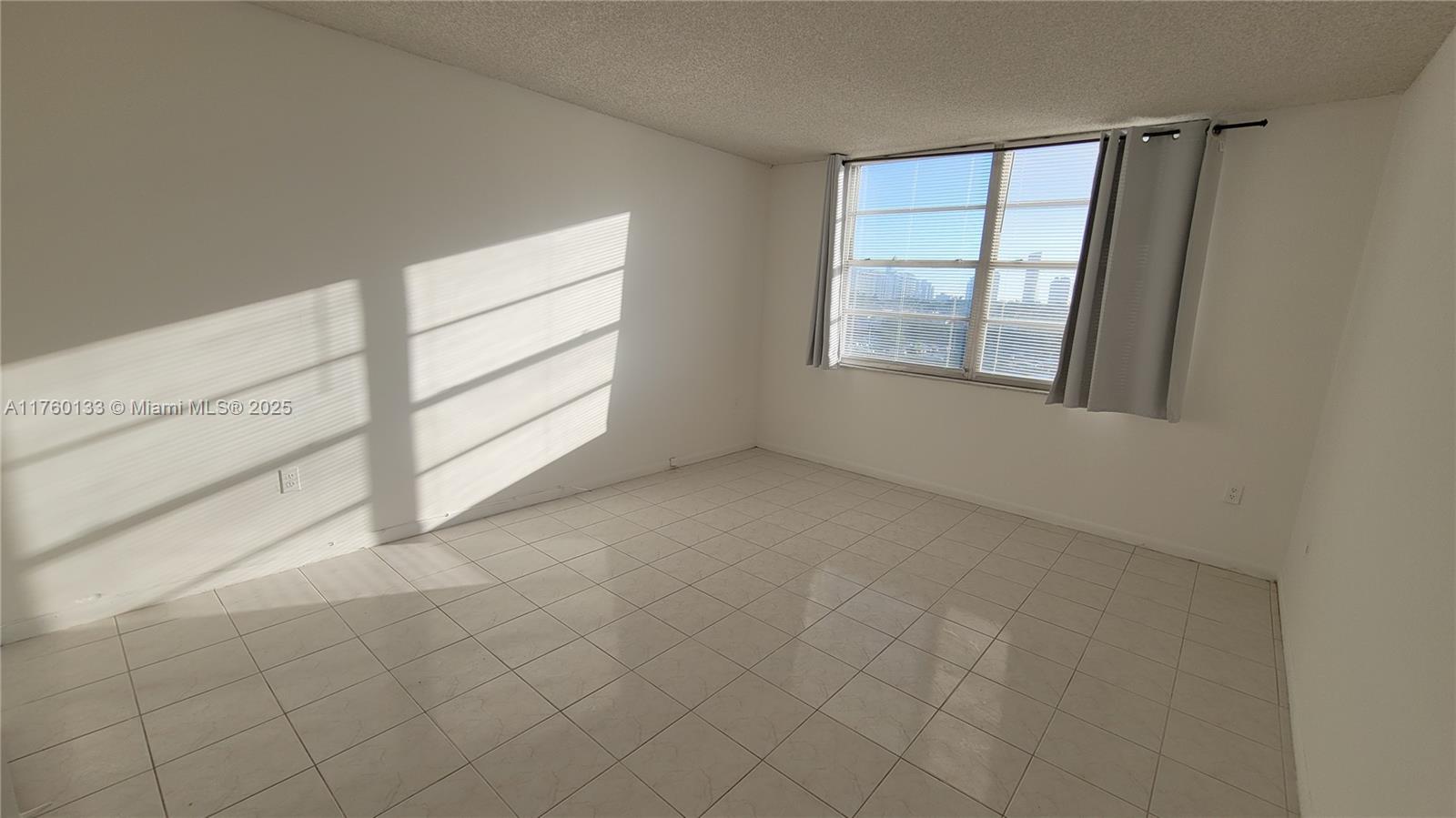 2801 Northeast 183rd Street, Unit 504W Aventura, FL 33160 - Photo 27 of 36 an empty room with windows