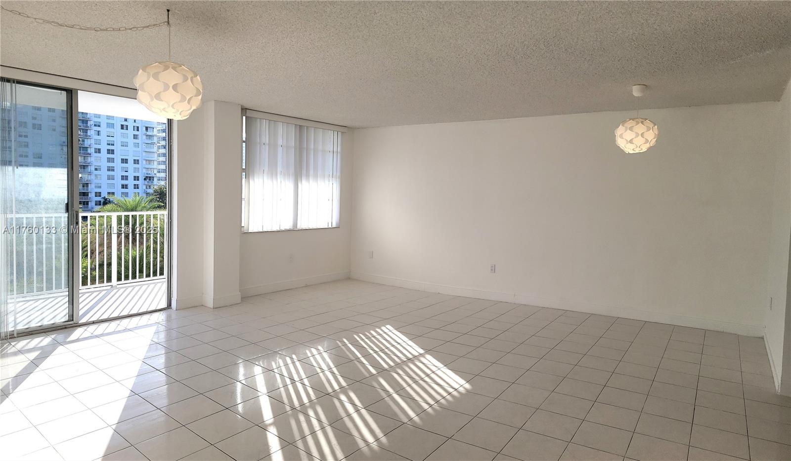 2801 Northeast 183rd Street, Unit 504W Aventura, FL 33160 - Photo 4 of 36 a view of an empty room with a window