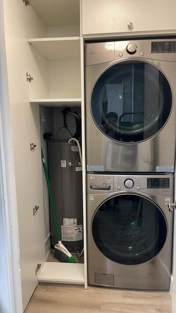 299 Northwest 52nd Terrace, Unit 118 Boca Raton, FL 33487 - Photo 11 of 28 a utility room with a washer and dryer