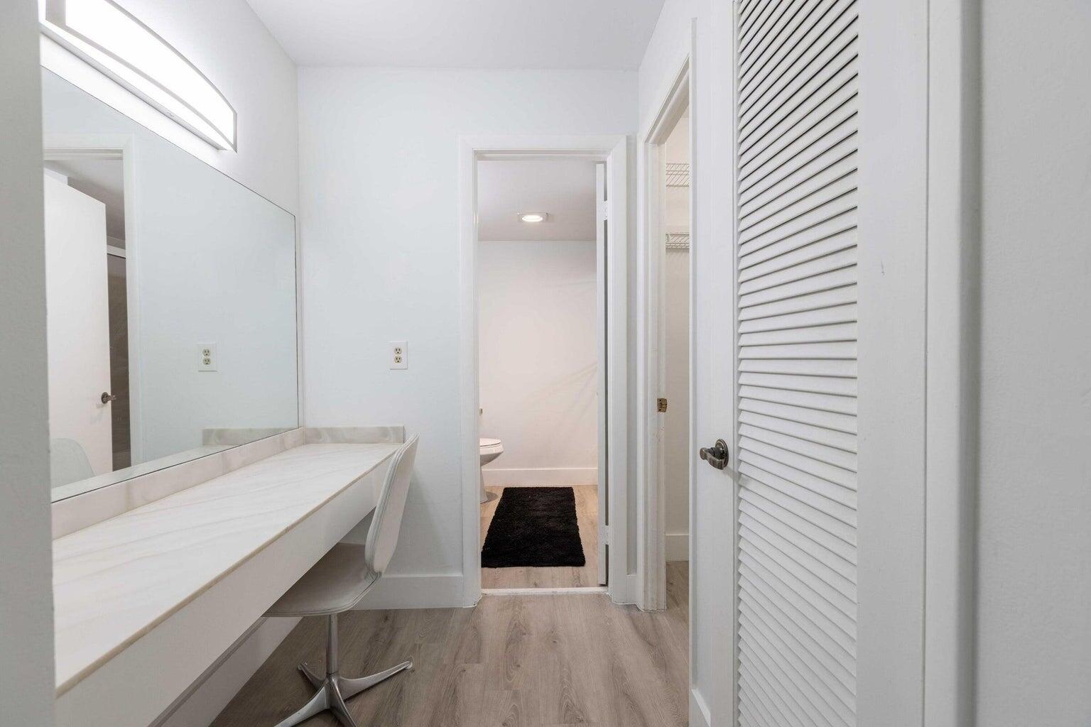 299 Northwest 52nd Terrace, Unit 118 Boca Raton, FL 33487 - Photo 16 of 28 a bathroom with a sink and a mirror