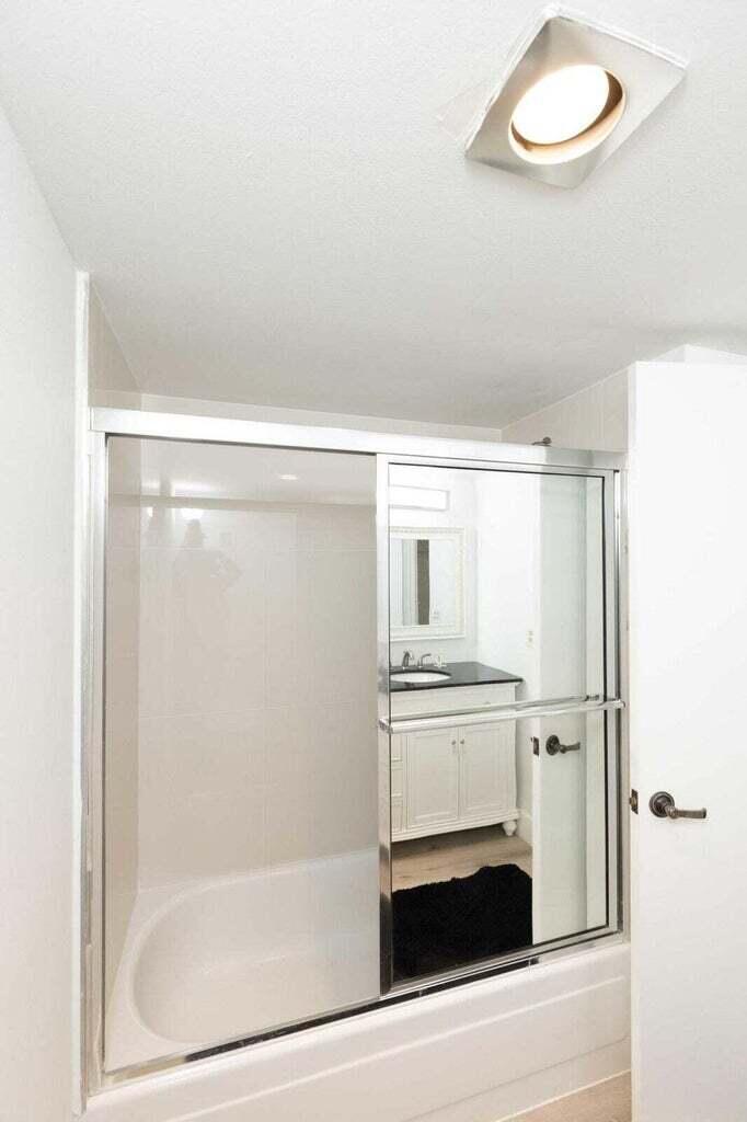 299 Northwest 52nd Terrace, Unit 118 Boca Raton, FL 33487 - Photo 18 of 28 a bathroom with a sink and mirror