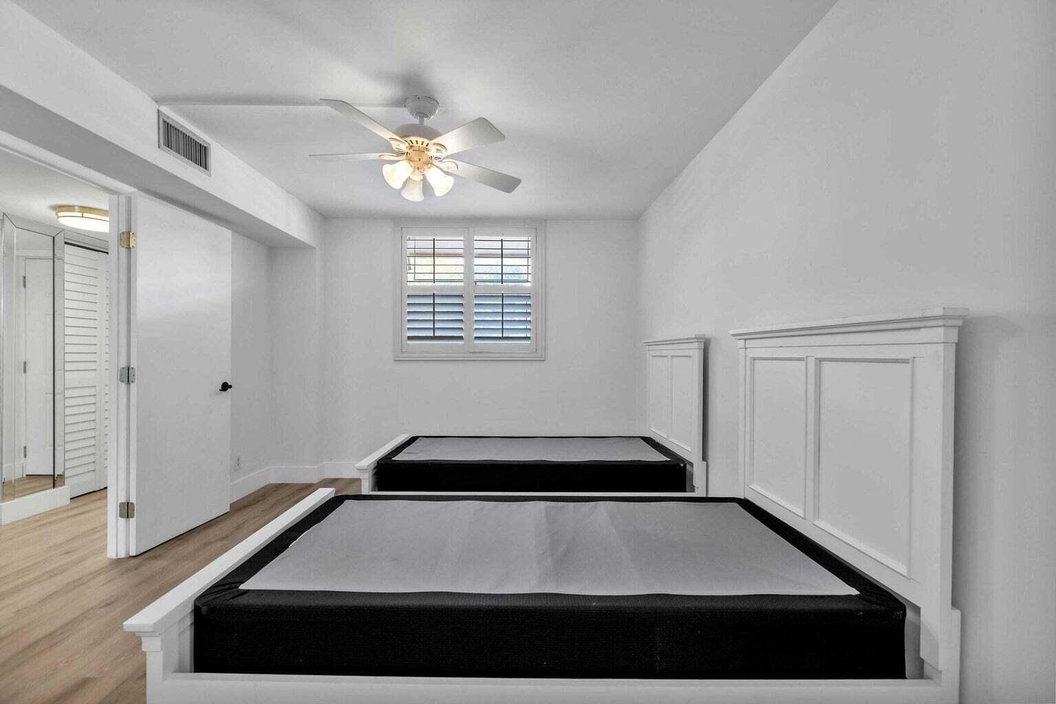 299 Northwest 52nd Terrace, Unit 118 Boca Raton, FL 33487 - Photo 22 of 28 a view of outdoor space with windows and ceiling fan