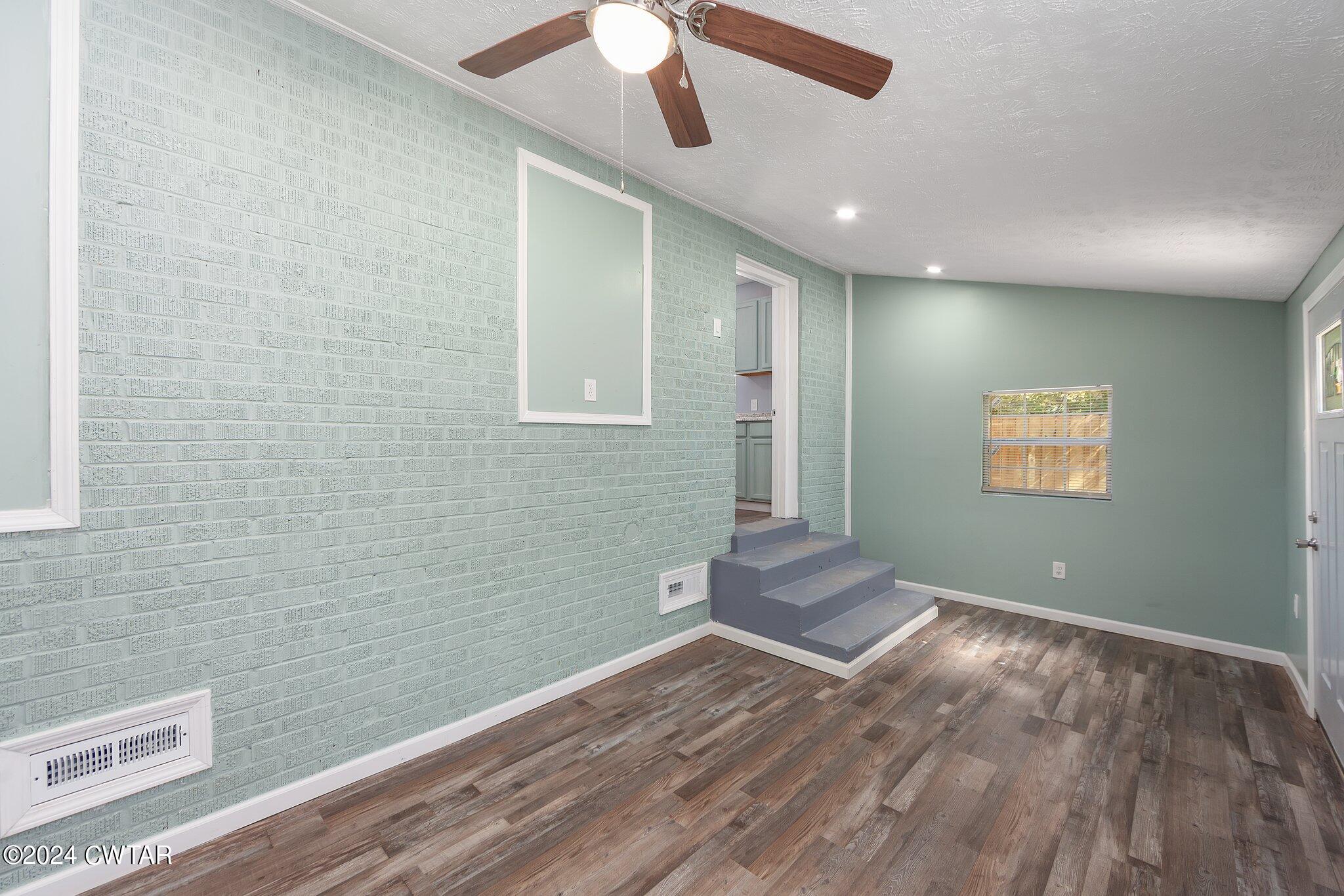 62 Everett Street Jackson, TN 38301 - Photo 15 of 28 a view of empty room with wooden floor