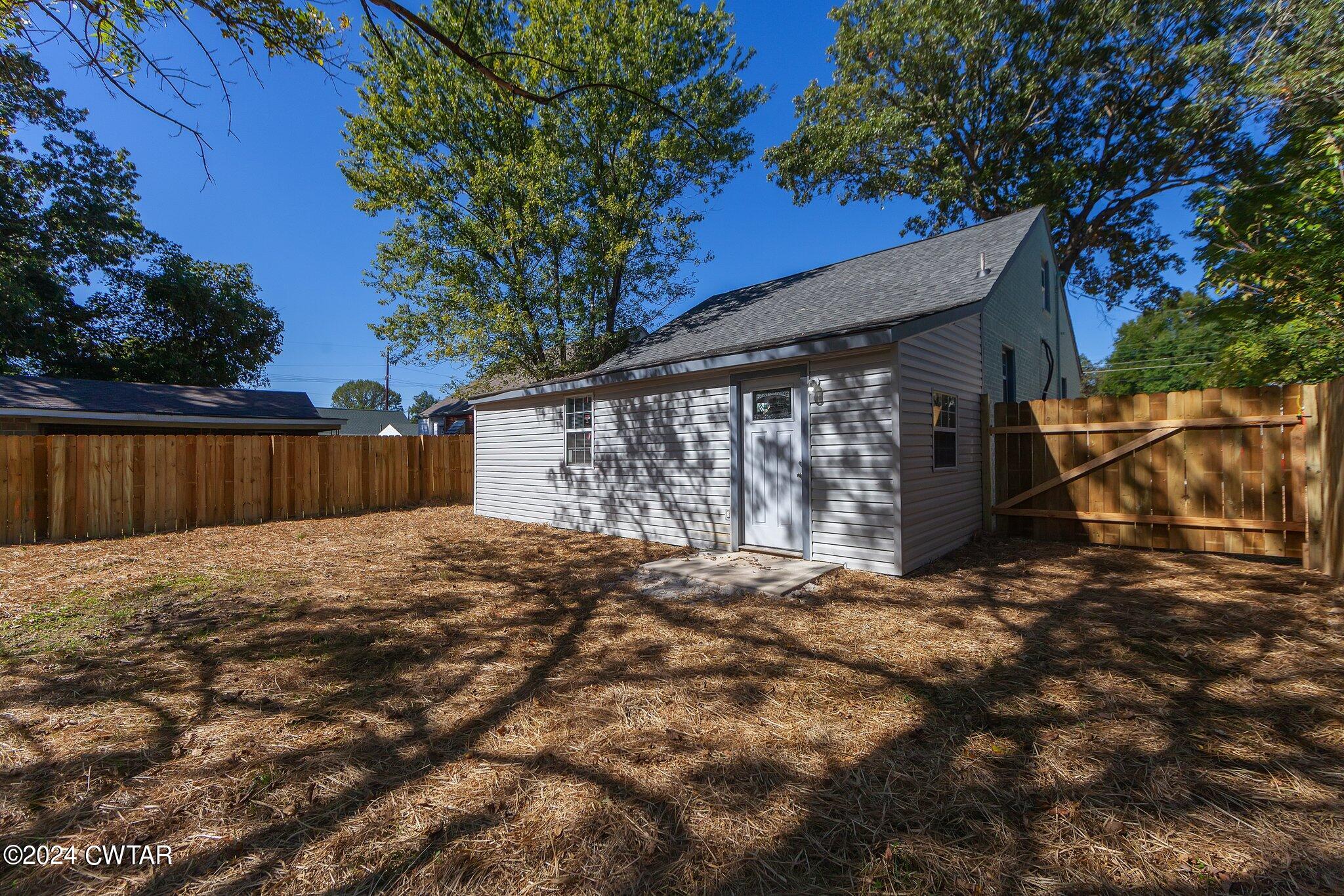 62 Everett Street Jackson, TN 38301 - Photo 23 of 28 a view of a house with a yard